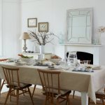 Large kitchen table with plain tablecloth