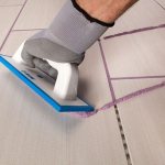 Grouting tiles